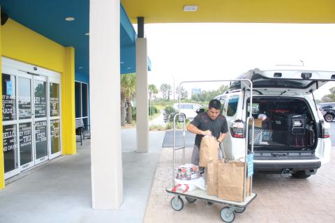 Long Vu, from Tampa, unpacks his vehicle at the Tru by Hilton hotel in Lake City in September. Columbia County’s Tourism Development Council said the county had collected over $2 million in bed taxes for the first time ever. (FILE)