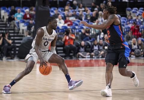 Xavier guard Souley Boum (left) is defended by Florida guard Trey Bonham during the opening round of the Phil Knight Legacy on Thursday in Portland, Ore. (CRAIG MITCHELLDYER/Associated Press)