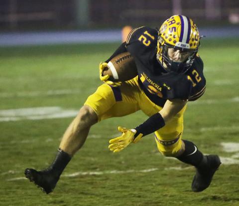 Columbia receiver Camdon Frier turns up the field after a catch against Choctawhatchee in Friday’s Region 1-3S final. (BRENT KUYKENDALL/Lake City Reporter)