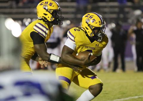 Columbia quarterback Tyler Jefferson hands the ball off to running back Tony Fulton vs. Ridgeview on Oct. 28. (BRENT KUYKENDALL/Lake City Reporter)