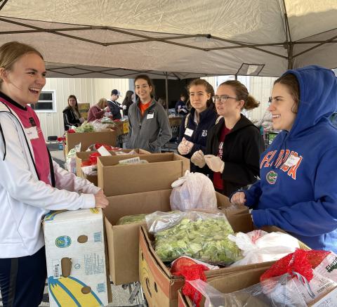 Volunteers helped prepare and pass out 600 Thanksgiving baskets as part of Catholic Charities’ distribution effort last week. (COURTESY)