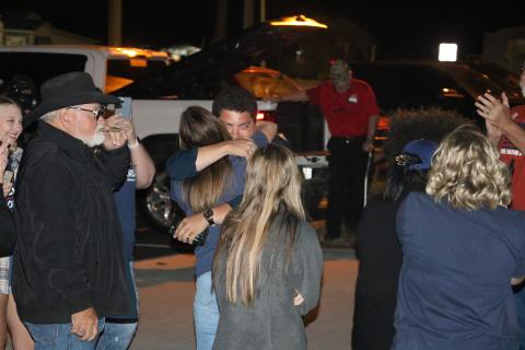 Hunter Peeler gets a hug from a supporter outside the Columbia County Supervisor of Elections Office on Tuesday night after winning the District 5 seat on the Columbia County School Board. (MORGAN MCMULLEN/Lake City Reporter)