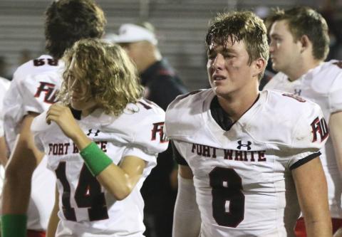 Fort White quarterback Clayton Philpot walks off the field after the Indians’ 36-0 loss to Madison County. (MORGAN MCMULLEN/Lake City Reporter)