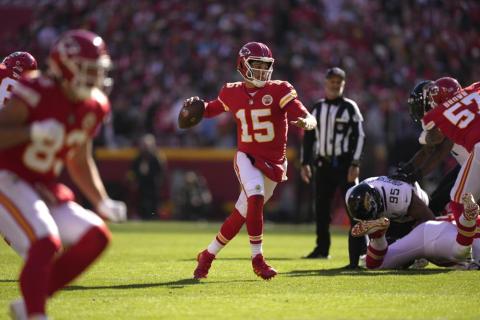 Kansas City Chiefs quarterback Patrick Mahomes runs as he throws as touchdown pass to wide receiver Marquez Valdes-Scantling against the Jacksonville Jaguars on Sunday in Kansas City, Mo. (CHARLIE RIEDEL/Associated Press)