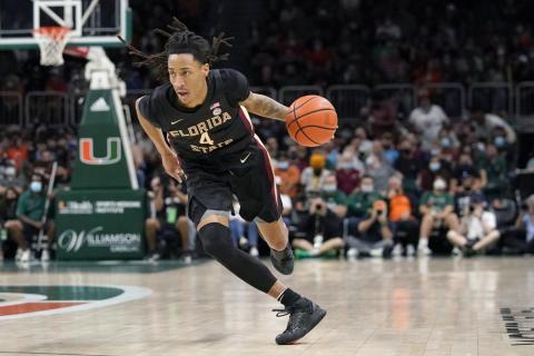 Florida State guard Caleb Mills drives to the basket against Miami on Jan. 22 in Coral Gables. (AP FILE)