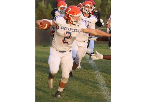 Branford running back Caden Coker uses a stiff arm earlier in the season. (FILE)