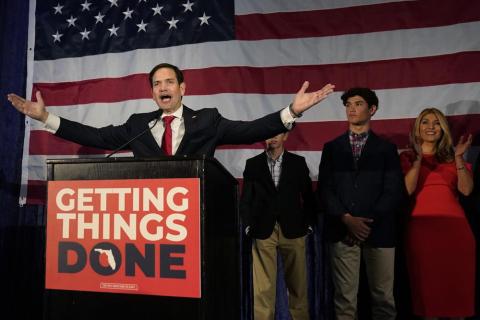 Sen. Marco Rubio celebrates with his family as he talks to supporters during an Election Night party Tuesday in Miami. (WILFREDO LEE/Associated Press