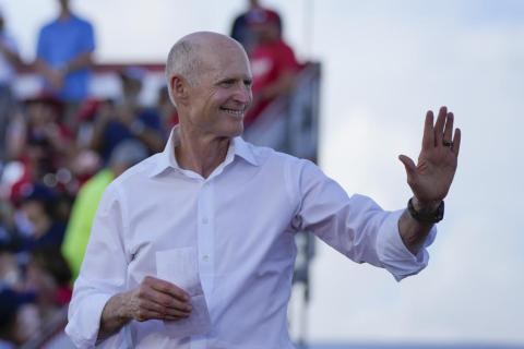 Sen. Rick Scott arrives to speak before former President Donald Trump at a campaign rally in support of the campaign of Sen. Marco Rubio on Nov. 6. (REBECCA BLACKWELL/AP File)