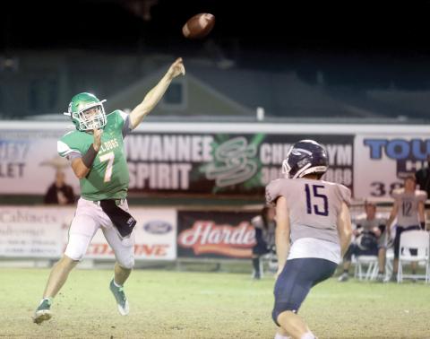 Suwannee quarterback Bronsen Tillotson (left) tosses a pass against Walton during Friday’sRegion 1-2S quarterfinal. (PAUL BUCHANAN/Special to the Reporter)