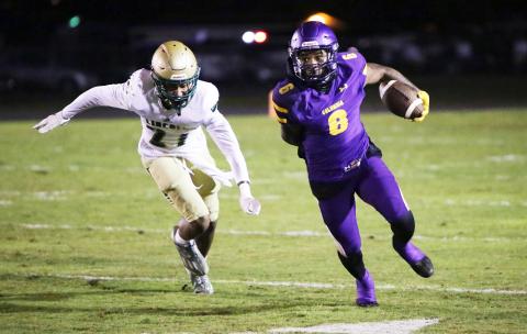 Columbia receiver Tray Tolliver runs up the field after a catch against Lincoln in the Region 1-3S quarterfinals on Nov. 11. (BRENT KUYKENDALL/Lake City Reporter)