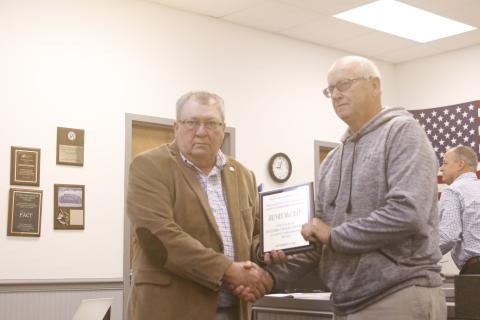 Henry McCray (right) receives a plaque for his four years of service on the Lafayette County Commission from Chairman Anthony Adams at Monday’s meeting. (JAMIE WACHTER/Lake City Reporter)