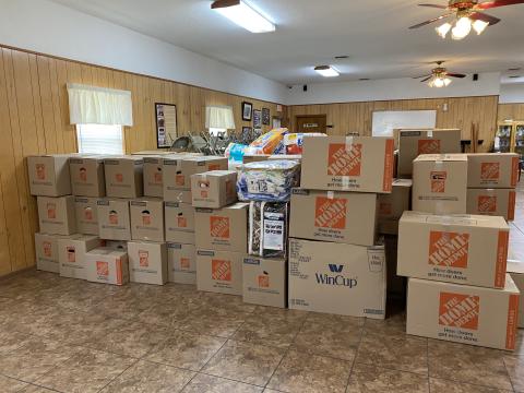Boxes of supplies sit ready to be shipped to Fort Myers last month after the devastation of Hurricane Ian swept through southwest Florida. (COURTESY)
