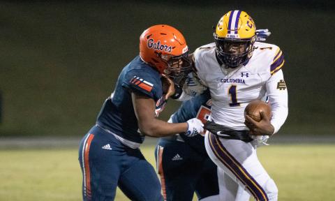 Columbia quarterback Tyler Jefferson tries to escape pressure from Escambia during the Region 1-3S semifinals on Nov. 18. (GREGG PACHKOWSKI/Pensacola News Journal)