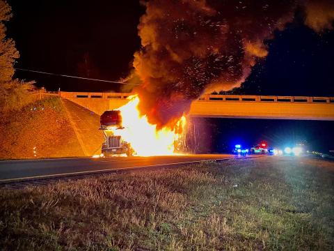 A tractor trailer transporting automobiles caught fire on Interstate 10 in Suwannee County on Thursday night, closing down the interstate for hours as firefighters battled the blaze. (COURTESY SUWANNEE FIRE RESCUE)