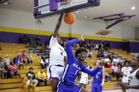Columbia forward Ty’jahn Wright dunks on Clay wingman J’den Golding on Wednesday night. (BRENT KUYKENDALL/Lake City Reporter)