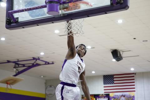 Columbia forward Seth Stockton dunks against Clay on Dec. 7. (BRENT KUYKENDALL/Lake City Reporter)