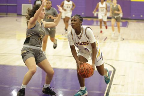 Columbia guard Ayesha Broxey drives to the basket as Buchholz guard Carly Fischer defends on Tuesday night. (BRENT KUYKENDALL/Lake City Reporter)