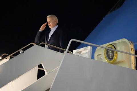 President Joe Biden salutes as he boards Air Force One at Andrews Air Force Base on Tuesday. Biden and his family are traveling to St. Croix, U.S. Virgin Islands, to celebrate New Year. (MANUEL BALCE CENETA/Associated Press)