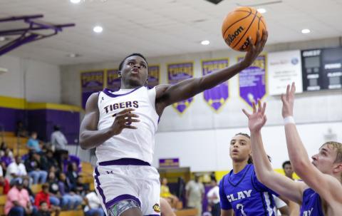 Columbia guard Isaac Broxey goes up for a layup against Clay on Dec. 7. (BRENT KUYKENDALL/Lake City Reporter)