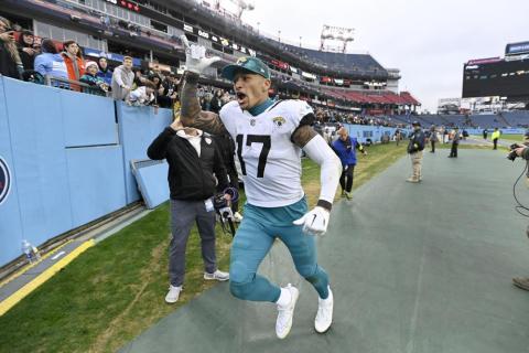 Jacksonville Jaguars tight end Evan Engram celebrates as he runs off the field a following 36-22 victory over the Tennessee Titans on Sunday in Nashville, Tenn. (MARK ZALESKI/Associated Press)