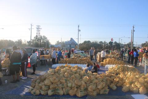 During Saturday’s Farm Share event sponsored by the Lake City Police Department, volunteers helped distribute 29,000 pounds of food. (TONY BRITT/Lake City Reporter)