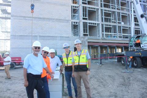Mahendra Patel (from left), Dr. Minesh Patel and Janak Shukla stand with Jordan Gray and Todd Gray of Gray Construction during the topping-out ceremony for the Courtyard by Marriott Hotel. The Morpheus Group is the management team behind operating the new hotel, while Oasis Lake City LLC is the development group bringing the hotel to Lake City. The hotel is scheduled to open by June 2023. (TONY BRITT/Lake City Reporter)