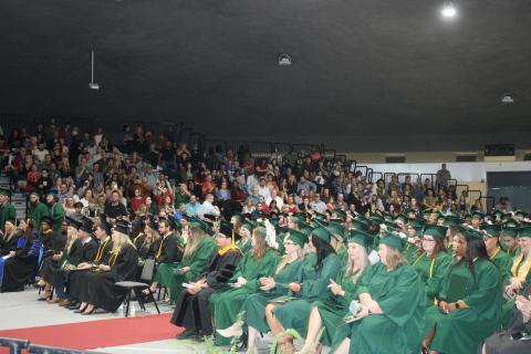 Florida Gateway College students listen during Thursday’s graduation ceremony in front of friends and family in attendance at the Howard Center. (TONY BRITT/Lake City Reporter)