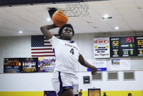 Columbia forward Ty’Jahn Wright rises for a dunk against Buchholz on Wednesday night. (JORDAN KROEGER/Lake City Reporter)