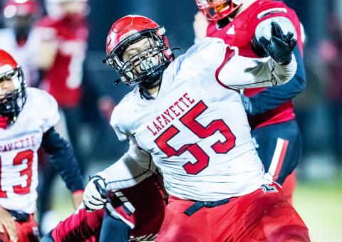 Lafayette defensive lineman Manny Watkins celebrates after making a tackle against Hilliard on Sept. 16. The Hornets won 21-14. (JACKO HOWDESHELL/Special to the Reporter)
