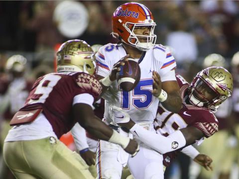 Florida State defensive end Derrick McLendon II (9) and defensive back Shyheim Brown (38) sack Florida quarterback Anthony Richardson (15) on Nov. 25 in Tallahassee. (PHIL SEARS/Associated Press)