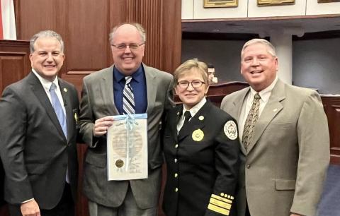 Columbia County Emergency Management Director Shayne Morgan (second from left) was recognized by state CFO Jimmy Patronis (left), Florida State Fire Marshal Director JoAnne Rice (second from right) and Representative Chuck Brannan Monday for his Chad Reed Emergency Management Professional of the Year award given to him back in February. (COURTESY)