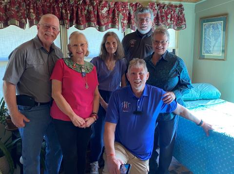 Sleep in Heavenly Peace’s Lake City chapter, including chapter co-presidents Pastor Aaron Ankeny (front on knee) and Bob Santos (back right) delivered its first bed last Saturday. (COURTESY)