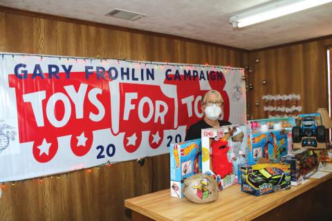 Toys for Tots Coordinator Inga Dwyer sorts through donated toys back in 2020. After giving out toys last week for Christmas, the organization is looking for a new location to provide services. (FILE)