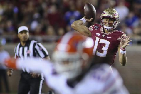 Florida State quarterback Jordan Travis throws a pass against Florida on Nov. 25 in Tallahassee. (PHIL SEARS/Associated Press)