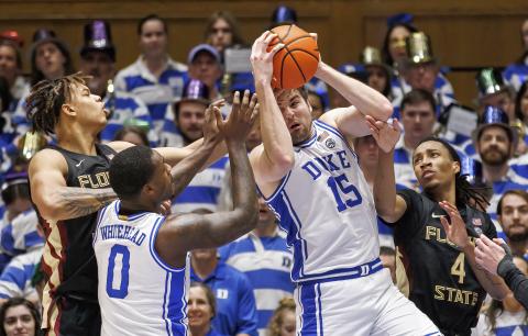Duke's Ryan Young (15) grabs a rebound ahead over Dariq Whitehead (0), Florida State's Caleb Mills (4), and Cam Corhen (3) on Dec. 31 in Durham, N.C. (BEN MCKEOWN/Associated Press)