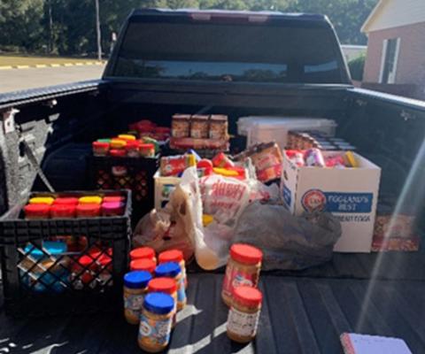 Peanut butter collected in Lafayette County is delivered to a local food bank for school backpack programs and needy families. (COURTESY)