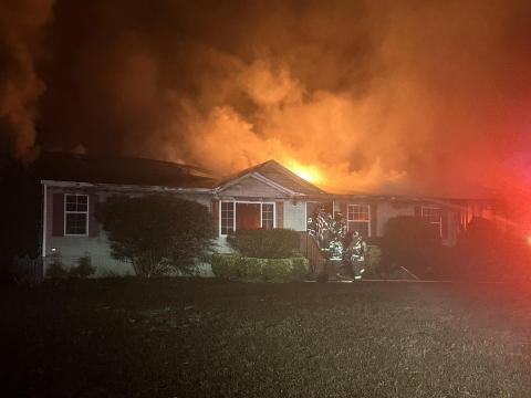 Suwannee County firefighters battle a house fire Sunday morning in western Suwannee County. Nobody was injured in the fire. (COURTESY SUWANNEE COUNTY FIRE RESCUE)