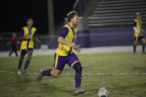 Columbia's Mickey Johnson dribbles the ball up the field against Palatka on Jan. 17. (BRENT KUYKENDALL/Lake City Reporter)