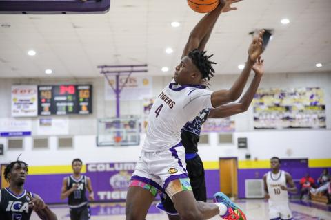 Columbia forward Ty'jahn Wright flies down the baseline for a dunk against Impact Christian Academy last Thursday. (BRENT KUYKENDALL/Lake City Reporter)