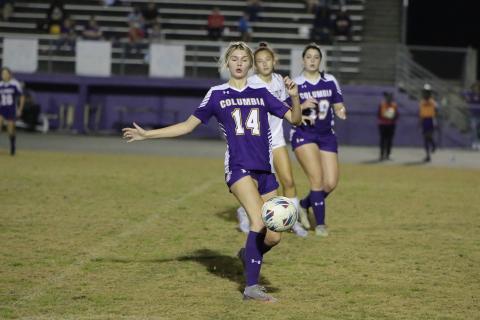 Columbia's Mia Brasel corrals the ball during Tuesday's match against Buchholz. (BRENT KUYKENDALL/Lake City Reporter)