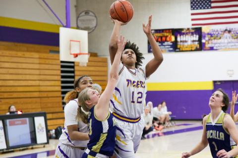 Columbia forward Jolena Gardner shoots over Aucilla Christian forward Anna Drawdy on Monday night. (BRENT KUYKENDALL/Lake City Reporter)