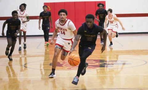 Columbia guard Isaac Broxey comes up with a steal that turned into a dunk against Baker County on Friday. (JORDAN KROEGER/Lake City Reporter)