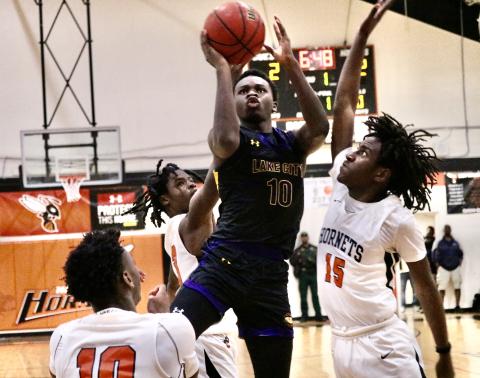 Columbia guard Isaac Broxey puts up a floater against Hawthorne on Thursday night. (JORDAN KROEGER/Lake City Reporter)