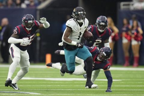 Jacksonville Jaguars running back Travis Etienne Jr. (1) runs for a touchdown against the Houston Texans during Sunday's game in Houston. (ERIC CHRISTIAN SMITH/Associated Press)