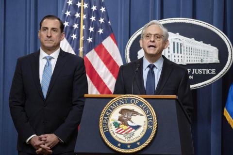 Attorney General Merrick Garland speaks during a news conference at the Department of Justice on Thursday in Washington as John Lausch, the U.S. Attorney in Chicago, looks on. (MANUEL BALCE CENETA/Associated Press)