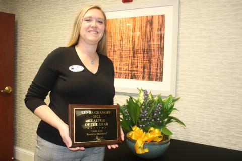 Lynda Granoff poses with her award after winning the 2022 Realtor of the Year honor from the Lake City Board of Realtors. (TONY BRITT/Lake City Reporter)