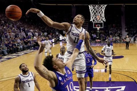 Kansas State forward Keyontae Johnson blocks a shot by Kansas forward Jalen Wilson on Jan. 17 in Manhattan, Kan. (CHARLIE RIEDEL/Associated Press)