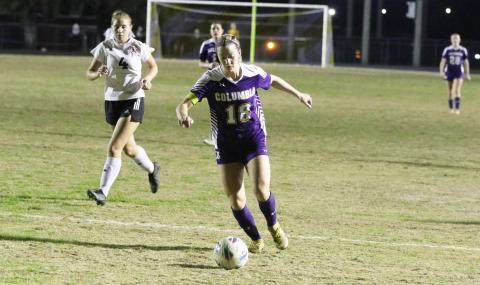 Columbia’s Skyler Ziegaus dribbles the ball up the field against Middleburg on Thursday night. (MORGAN MCMULLEN/Lake City Reporter)