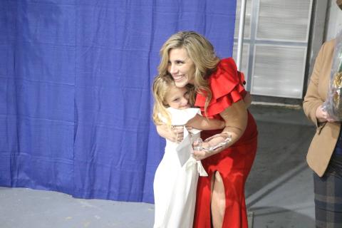 Suwannee Springcrest Elementary teacher Emily Murphy receives a hug from Andi Mae Collins, a former student, after being named Suwannee County’s Teacher of the Year on Thursday at the Suwannee County Coliseum. (MORGAN MCMULLEN/Lake City Reporter)