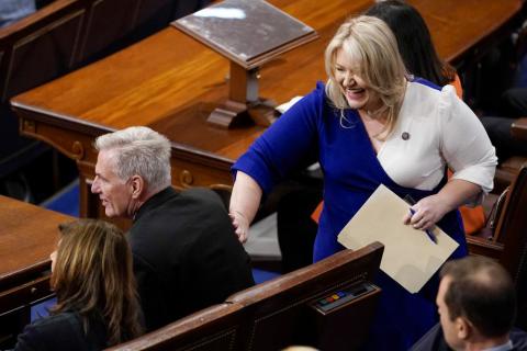 Rep. Kat Cammack, R-Fla., pats Rep. Kevin McCarthy, R-Calif., on the back after she nominated him as speaker for the sixth round of voting in the House chamber as the House meets for a second day to elect a speaker and convene the 118th Congress in Washington on Wednesday. (ANDREW HARNIK/Associated Press)